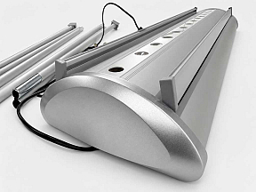 TwinGlow illuminated roller banner cassette with integrated LED lighting system and premium silver aluminium base for exhibition displays TwinGlow illuminated roller banner cassette with integrated LED lighting system and premium silver aluminium base for exhibition displays