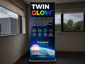 TwinGlow light-up roller banner showcasing enhanced visibility compared to traditional non-lit pull-up banners TwinGlow light-up roller banner showcasing enhanced visibility compared to traditional non-lit pull-up banners